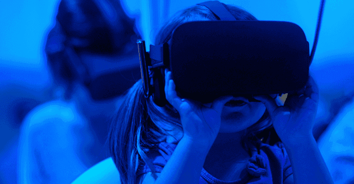 Children using VR headsets as part of government tech initiatives to build immersive experiences