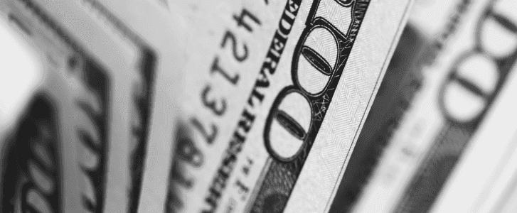 closeup photo of 100 us dollar banknotes to highlight the growing costs of shadow it